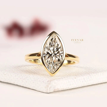 Bezel Set Marquise Cut Lab Grown Split Shank Engagement Ring