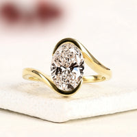 Oval Cut Moissanite Diamond Bypass Ring with Half Bezel Setting