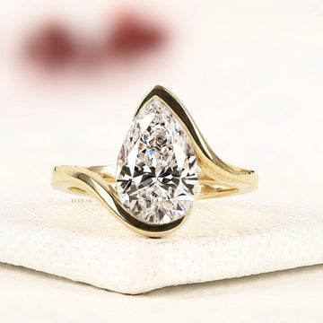Pear Cut Lab Grown Diamond Bypass Ring in Half Bezel Setting