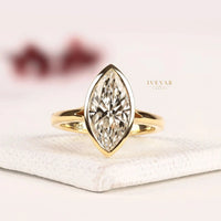 Bezel Set Marquise Cut Moissanite Split Shank Engagement Ring