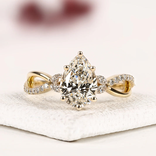 Pear Cut Moissanite Diamond Infinity Twist Engagement Ring