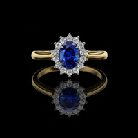 0.45 CT Fancy Vivid Blue Oval Ring with Brilliant Lab Grown Diamond Inspired Halo Accent