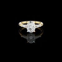 Oval Cut Moissanite Engagement Ring With Baguette Side Stones