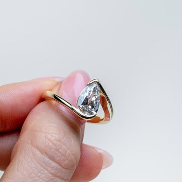1.00 CT Aurora Flow Pear Cut Lab Diamond Ring with Sculptural Bypass Embrace For Your Girl