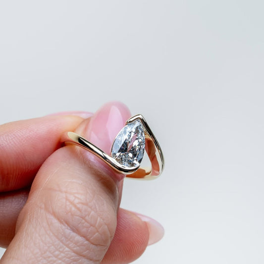 1.00 CT Aurora Flow Pear Cut Lab Diamond Ring with Sculptural Bypass Embrace For Your Girl