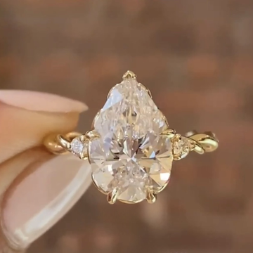 2.00 CT Celestial Pear Shaped Lab Grown Diamond Engagement Ring with Twisted Accent