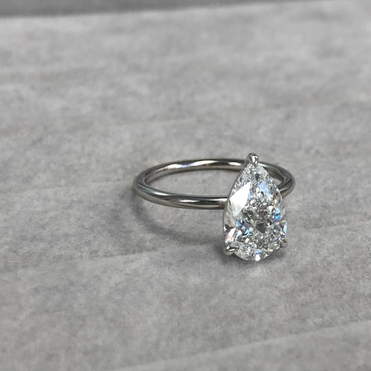 3.51 TCW Graceful Pear Cut Lab Solitaire Ring with Classic Three Prong Setting and Slim High Polish Gold Band