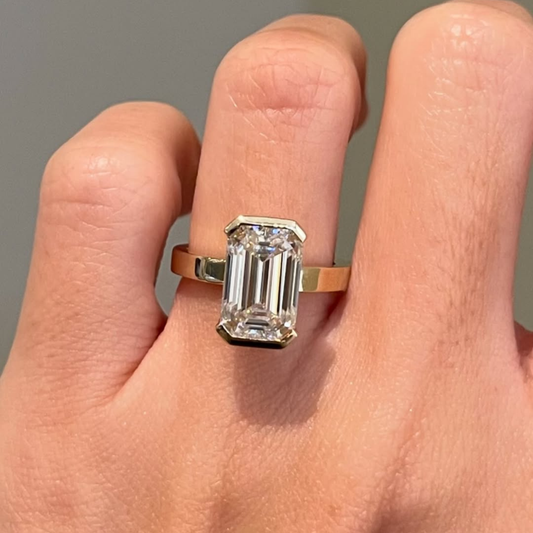 Emerald Lab Grown Half Bezel Solitaire Ring With Wide Gold Band
