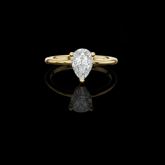 0.90 TCW Luxurious Pear Shaped Lab Grown Diamond Solitaire Ring in Classic Gold